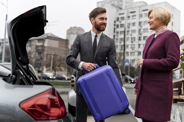 Private Chauffeur Adelboden helping client with the luggages